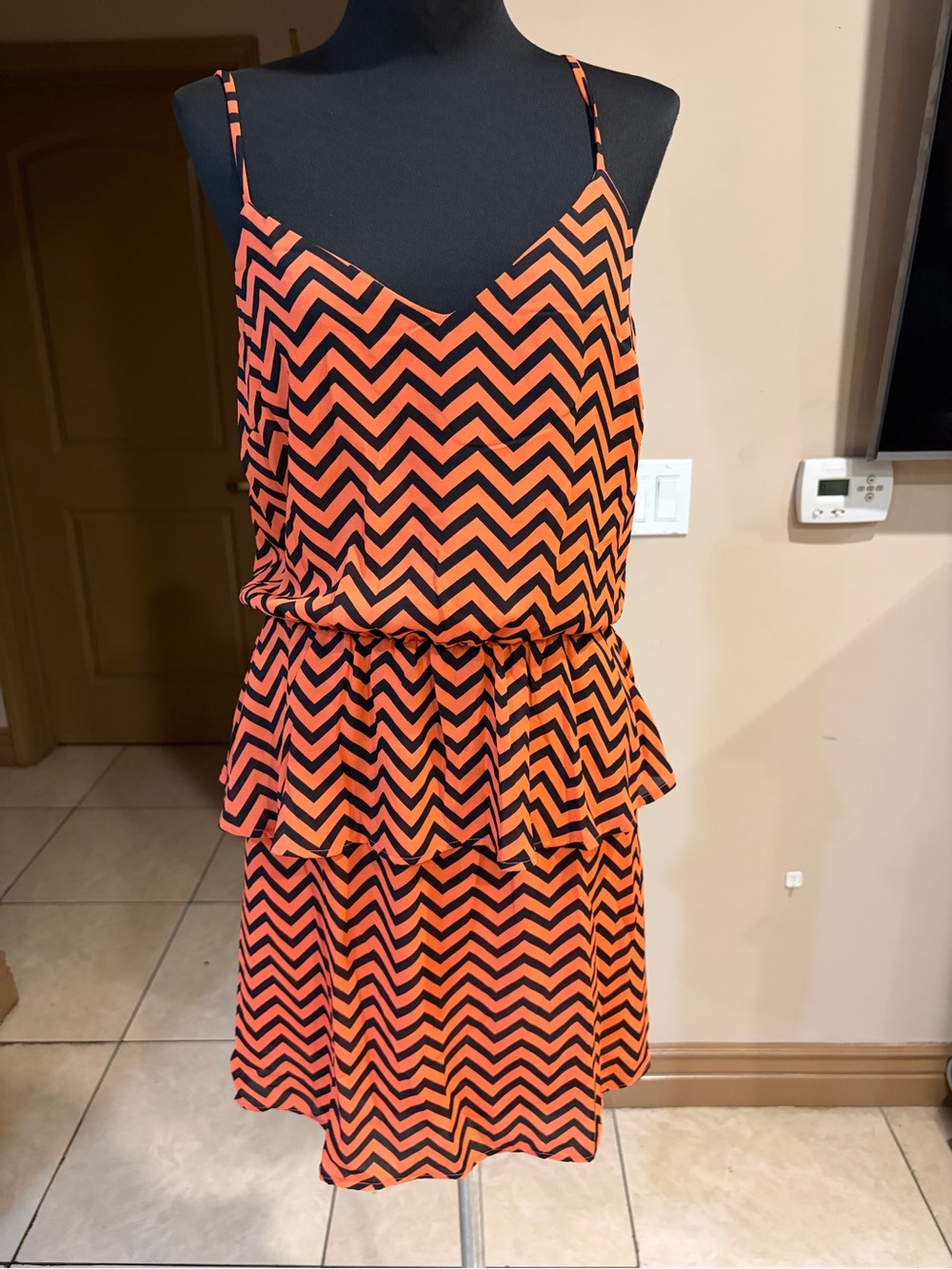 Orange and black chevron print mini dress.